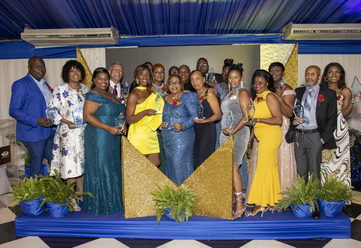 The Trade Board Limited’s long-serving employees and top performers share a moment following the agency’s 40th Anniversary Employee Service Awards Ceremony, held at the Terra Nova All-Suite Hotel in Kingston on June 10.