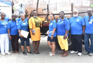 Members of the Jamaica Nurses Association of Florida pose in front of the truckload of medical supplies donated to Percy Junor Hospital on Tuesday, August 16. They are (from left) Shirley White-Dawkins, Oswald Dixon, Joan Howard; Acting CEO, Percy Junor Hospital, Sharon Hibbert Hemmings; Dr. Ann Marie Allen of Baptist Health Hospital; Vice President, Jamaica Nurses Association of Florida, Dr. Beverlyn Allen; Walcott Allen and Karl Bailey.