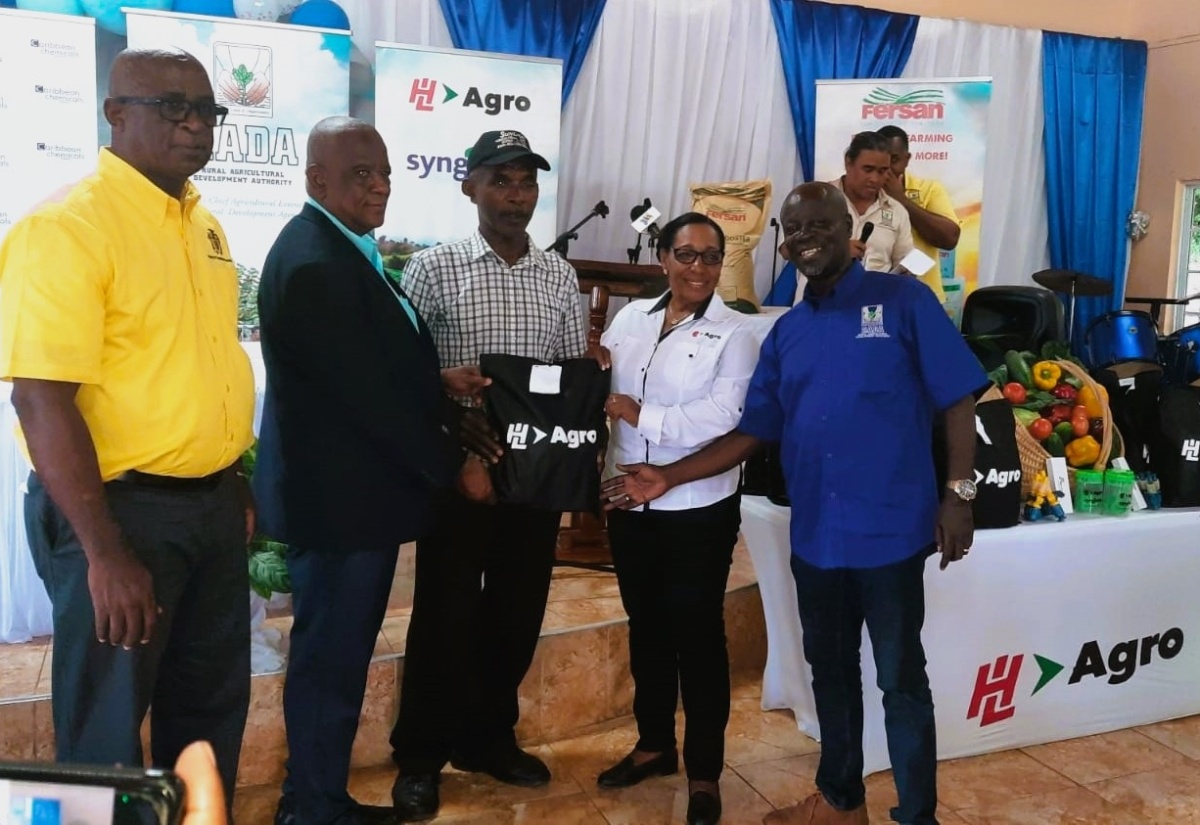 Minister of State in the Ministry of Agriculture, Fisheries and Mining, Hon. Franklin Witter (second from left) and Deputy Chief Executive Officer of Hardware and Lumber (H&L) Agro, Olive Downer Walsh (second from right) present farm supplies to South St. Elizabeth-based farmer, Henrick Francis (centre) during an official handover ceremony held at the Bull Savannah Church of God of Prophecy in the parish on June 29. Also taking part in the presentation are (from left) Chief Technical Director at the Ministry, Orville Palmer; and Acting Chief Executive Officer of the Rural Agricultural Development Authority (RADA), Winston Simpson.
