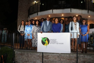 Jamaica’s Ambassador to the United States, Audrey Marks (front, right) and Chairman of the Jamaica Howard University Affinity Network (JHUAN), Don Christian (front, left), are surrounded by Jamaican students attending Howard University, who have been awarded scholarships totalling US$80,000 by JHUAN. The award ceremony was held recently at the Ambassador’s residence in Maryland.