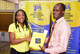 Jamaica Information Service (JIS) Acting Special Projects Manager, Charnele Henry (left), hands over JIS publications to Acting Principal of the Tarrant High School, Bryan Dennis. The JIS team stopped at the institution’s Molynes Road campus in St. Andrew on Tuesday (September 26) as part of the agency’s annual Heritage School Tour, which engages students in activities and discussions that promote the country’s heritage. The tour is in observance of National Heritage Week 2023 from October 9 to 16 under the theme ‘Celebrating a Proud Heritage… Resilient and Strong’.

