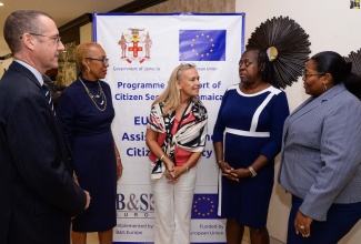 Minister of Education and Youth, Hon. Fayval Williams (second left), European Union Ambassador to Jamaica, Marianne Van Steen (centre), and Jamaica Development Representative in the Foreign Commonwealth and Development Office at the British High Commission in Jamaica, Oliver Blake (left), share a photo opportunity with principals during Friday’s (September 15) Inter-Ministerial School Support Strategy Partners Summit at The Jamaica Pegasus hotel in New Kingston. From second right are Principal, St Andrew Primary School, Colleen Gordon, and Principal, Edward Seaga Primary and Infant School, Shernet Tomlinson.