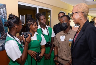 Minister of Education and Youth, Hon. Fayval Williams (right), interacts with students of Manchester High School on Thursday (September 14). The occasion was a function at the institution to mark the ceremonial reopening of educational institutions in Manchester for the 2023/24 academic year

