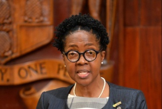 Director of Health Services Planning and Integration, Dr. Nadine Williams, speaks at a post-Cabinet press briefing, on September 27, at Jamaica House.