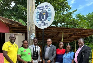 Stakeholders participate in the recent commissioning of a community Wi-Fi facility that was installed in Harmons Valley, Manchester, by the Universal Service Fund (USF). From left are President, Youth Sub-Committee, Parish Development Committee, Nicardo Miller; Councillor, Porus Division, Manchester, Claudia Morant-Baker; Marketing and Public Relations Manager, USF, Oraine Wallace; Member of Parliament, Manchester South, Robert Chin; community member, Pusey Hill, Creigh Pitter; Parish Manager, Social Development Commission, Manchester, Beverley Booths, and Elder, Harmons Valley Seventh-day Adventist Church, Tyrone Gregory.

