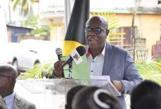 Mayor of Falmouth and Councillor of the Warsop Division in Trelawny, Colin Gager, addresses the commissioning ceremony for free Wi-Fi service in the communities of Troy and St. Vincent, in the parish, in Troy square, on Monday (October 9).