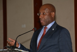 Industry, Investment, and Commerce Minister, Senator the Hon. Aubyn Hill, addresses the three-day CanEx Jamaica Business Conference at the Montego Bay Convention Centre in Rose Hall, St. James, on Friday (October 20).