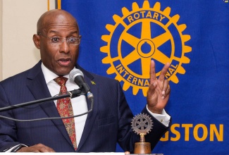 Minister of Industry, Investment and Commerce, Senator the Hon. Aubyn Hill, delivers the keynote address at a general breakfast meeting of the Rotary Club of New Kingston at the Liguanea Club, today (October 27).