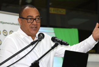 Minister of Health and Wellness, Dr. the Hon. Christopher Tufton, addresses the National Mental Health Conference, held today (October 10) at the Jamaica Conference Centre in downtown Kingston.