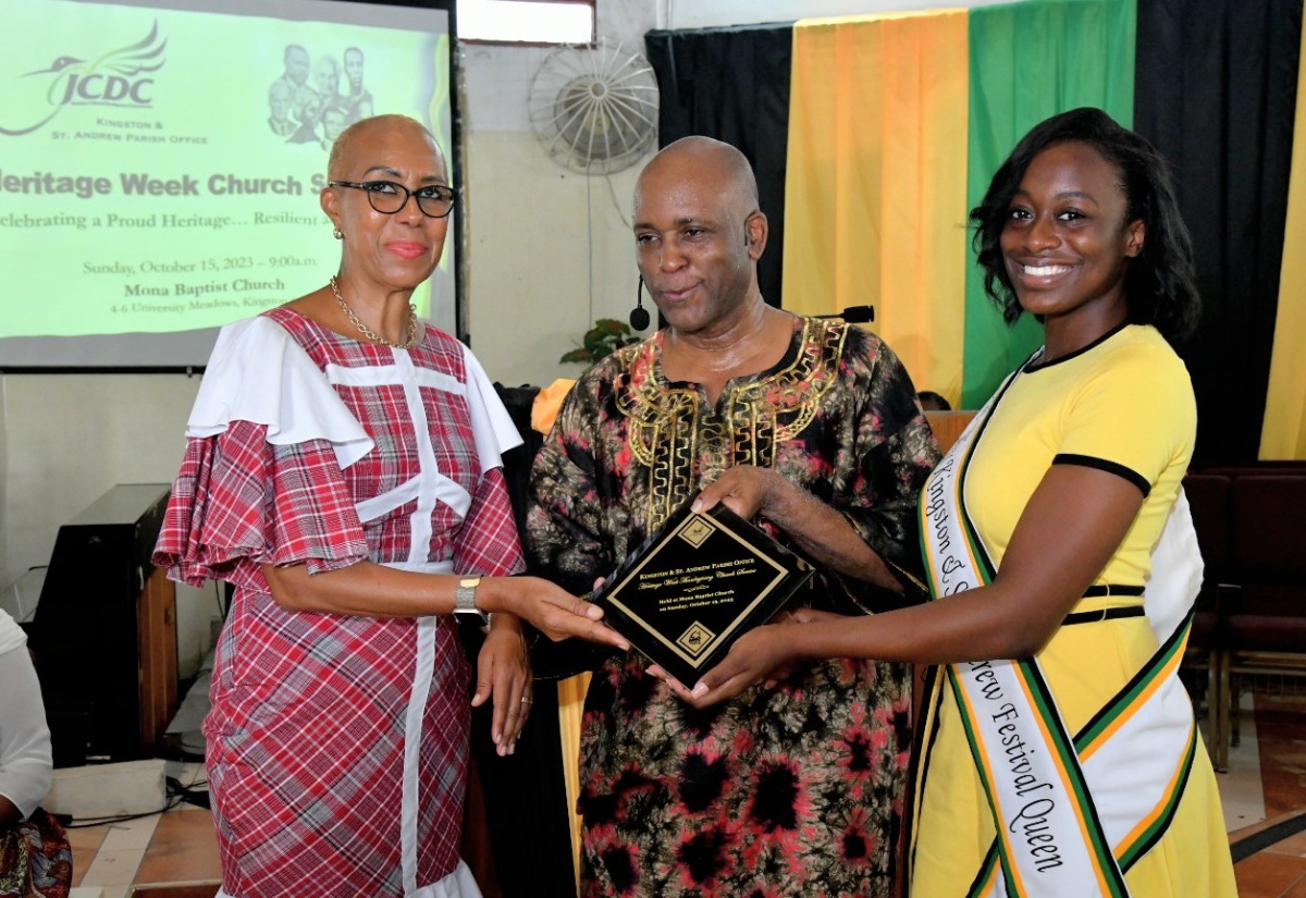 Minister of Education and Youth, Hon. Fayval Williams (left), and Kingston and St. Andrew Festival Queen 2023, Jhanielle Powell (right), make a presentation to Pastor of the Mona Baptist Church, Rev. Dr. Stephen Jennings,  at the Jamaica Cultural Development Commission’s (JCDC) Heritage Week church service held at the church in Papine, St. Andrew on Sunday, October 15.

 