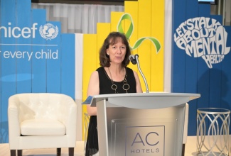 United Nations Children's Fund (UNICEF) Representative for Jamaica, Olga Isaza, addresses the Youth Mental Health Summit at the AC Hotel by Marriott in New Kingston on Wednesday (October 11).