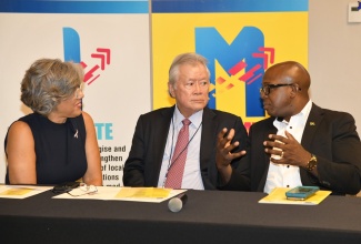 Minister of Labour and Social Security, Hon. Pearnel Charles Jr. (right),  speaks with Chairperson of the Council of Voluntary Social Services (CVSS), Kim Mair; and President of CVSS, Gary Hendrickson. Occasion was the launch of the CVSS’ Advocate, Innovate and Mobilise (AIM) initiative on October 12 at the AC Hotel by Marriott in Kingston. AIM aims to strengthen the capacity of civil society organisations to deliver programmes to the vulnerable groups that they serve. The 30-month intervention is being funded by the European Union (EU).

