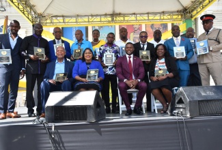 Deputy Mayor of Montego Bay, Councillor Richard Vernon (seated second right), is flanked by recipients of the Sam Sharpe Awards and the Mayor’s Special Awards at the St. James Municipal Corporation’s National Heroes Day Civic and Awards ceremony, held at Sam Sharpe Square in Montego Bay on Monday (October 16).