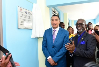Prime Minister, the Most Hon. Andrew Holness (left) and Local Government and Community Development Minister, Hon. Desmond McKenzie, at the official opening of the new male ward at the Westmoreland Infirmary.

