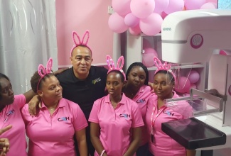 Minister of Health and Wellness, Dr. the Hon. Christopher Tufton, with Mammogram specialists (from left): Sharifa Williams, Camille Waite Kerr, Elissa McKoy, Carlene Ricketts and Sanecia Grant at the unveiling of a mammogram machine at the Cornwall Regional Hospital, St. James, on October 12.

