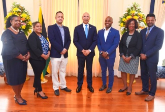Governor-General, His Excellency the Most Hon. Sir Patrick Allen (centre), shares a photo opportunity with (from left) Manager, Marketing and Corporate Communications, Scientific Research Council (SRC), Carolyn Rose Miller; Principal Director in the Ministry of Science, Energy, Telecommunications and Transport , Dr. Natwaine Gardner; Chairman of the SRC Board, Dr. Parris Lyew-Ayee Jr.; Executive Director, SRC, Dr. Ryan Francis; Executive Director, National Commission on Science and Technology (NCST), Dr. Olive Burrowes; and Section Head of the Nuclear Analytical Laboratory, International Centre for Environmental and Nuclear Sciences, Johann Antoine.  Occasion was a courtesy call by the team on the Governor-General at King’s House on Thursday (November 23).


