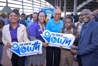 Education and Youth Minister, Hon. Fayval Williams (centre), with (from left) Acting Senior Director in the Youth Adolescent Division in the Ministry, Yanique Willaims; Permanent Secretary in the Ministry, Dr. Kassan Troupe; grade seven Pembrooke Hall High School student, Junior Johnson; and Joint United Nations Programme on HIV/AIDS (UNAIDS) Multi- Country Director, Amenyah Richard. The event was the launch of National Youth Month 2023 on November 3 at the Half -Way Tree Transport Centre in Kingston.