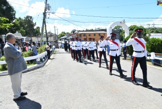 Custos Rotulorum for Clarendon, Hon. William Shagoury (left), takes the salute from members of the Jamaica Constabulary Force (JCF) during the parish’s Remembrance Day ceremony in Chapelton on Saturday (November 11) to honour Jamaicans who served during World Wars I and II.

