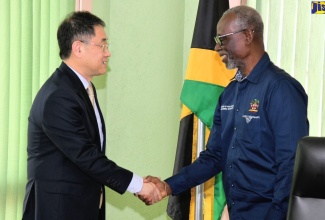 Minister of Local Government and Community Development, Hon. Desmond McKenzie (right), greets Vice President of the Chinese People’s Association for Friendship with Foreign Countries (CPAFFC), Jiang Jiang, during a courtesy call by a CPAFFC delegation at the Ministry’s Hagley Park Road offices in Kingston on Thursday (November 16).  The CPAFFC, which manages China’s sister-city relationships, aims to promote friendship and mutual understanding between the Chinese people and foreign nations.

