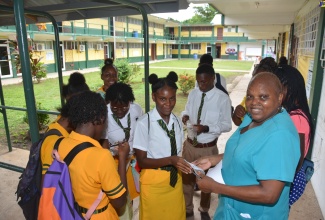 School Nurse, Denise Ennis, provides reading glasses to students during the Parents Day event at Petersfield High School in Westmoreland on Tuesday (November 14).