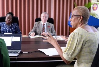 Minister of Education and Youth, Hon. Fayval Willams (right), addresses Members of the United Kingdom (UK) Parliament, Paulette Hamilton (left) and Mark Pawsey,  at the Ministry’s Heroes Circle offices on November 10. Occasion was a courtesy call by members of the UK Commonwealth Parliamentary Association.