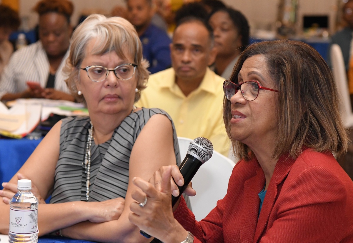 Permanent Secretary in the Ministry of Industry, Investment and Commerce, Sancia Templer (centre), converses with (from left), Chair, Trade Facilitation Task Force, Patricia Francis, and Chief Executive Officer, Jamaica National Agency for Accreditation, Sharonmae Shirley, during a National Consultation Workshop on the ‘Development of a Coordinated Laboratory Strategic Framework and Implementation Plan for Jamaica’, held at the Terra Noval All-Suite Hotel in Kingston on Wednesday (November 22).

