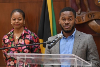 Member of the Constitutional Reform Committee, Sujae Boswell. Also pictured is Minister of Legal and Constitutional Affairs and Committee Chair, Hon. Marlene Malahoo Forte.  

