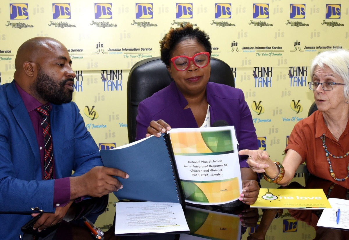 Senior Director, Children’s Affairs and Policy Division in the Ministry of Education and Youth (MOEY), Hyacinth Blair (centre); Director of Children and Family Programmes, Child Protection and Family Services Agency (CPFSA), Dr. Warren Thompson and Chair, Violence Prevention Alliance, Dr. Elizabeth Ward, peruse the MOEY’s National Plan of Action for an Integrated Response to Children and Violence (NPACV).  Occasion was a JIS Think Tank today (November 16).

 

