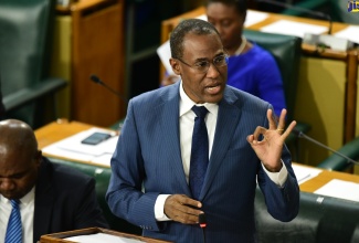 Minister of Finance and the Public Service, Dr. the Hon. Nigel Clarke, addresses the House of Representatives on Tuesday (December 19)