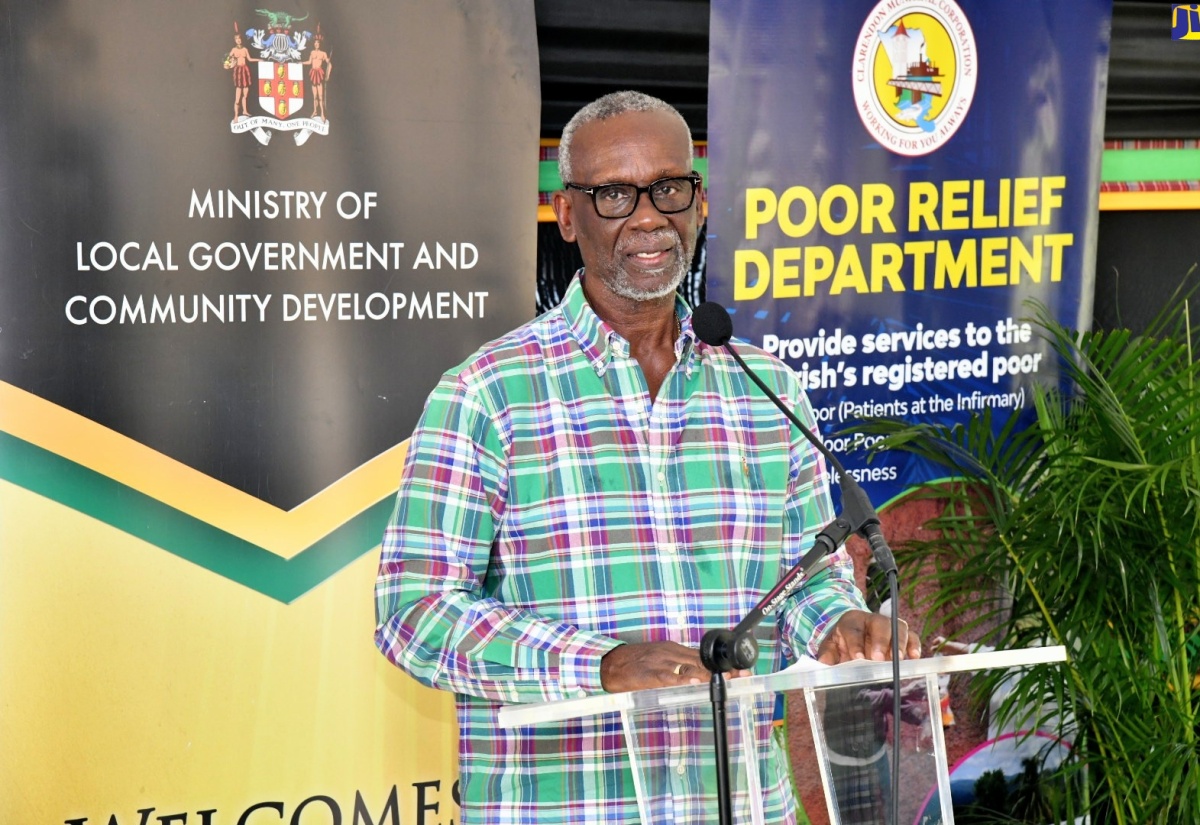 Minister of Local Government and Community Development, Hon. Desmond McKenzie, addresses Friday’s (December 8) official opening of the Clarendon Drop-In Centre and Night Shelter, which is located on the property of the Clarendon Infirmary.

