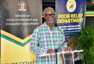 Minister of Local Government and Community Development, Hon. Desmond McKenzie, addresses Friday’s (December 8) official opening of the Clarendon Drop-In Centre and Night Shelter, which is located on the property of the Clarendon Infirmary.

