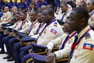 Members of the first cohort of the Haitian National Police (HNP) specialised training course, participate in the closing ceremony and presentation of certificates on Friday (Dec. 8) at the National Police College of Jamaica in St. Catherine. 