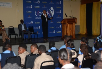 Minister of Education and Youth, Hon. Fayval Williams, addresses students at the Transforming Education for National Development (TREND) Pop-up event at Black River High School in St. Elizabeth on December 6.