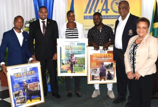 Minister of Agriculture, Fisheries and Mining, Hon. Floyd Green (second left); State Minister, Hon. Franklin Witter (second right); and Inter-American Institute for Cooperation on Agriculture (IICA) Representative in Jamaica, Dr. Elizabeth Johnson (right), share a moment with outstanding agricultural entrepreneurs who were recognised by the IICA, during a ceremony held on Wednesday (December 6), at the Terra Nova All-Suite Hotel in Kingston. They are (from left) first-place awardee, Kacheif Brown; second-place awardee, Ieasha Johnson; and third-place awardee, Junior Senior.

 