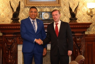 Prime Minister, the Most Hon. Andrew Holness (left), greets US National Security Advisor, Jake Sullivan, prior to their meeting at the Eisenhower Executive Office Building at the White House on Tuesday (December 5).

