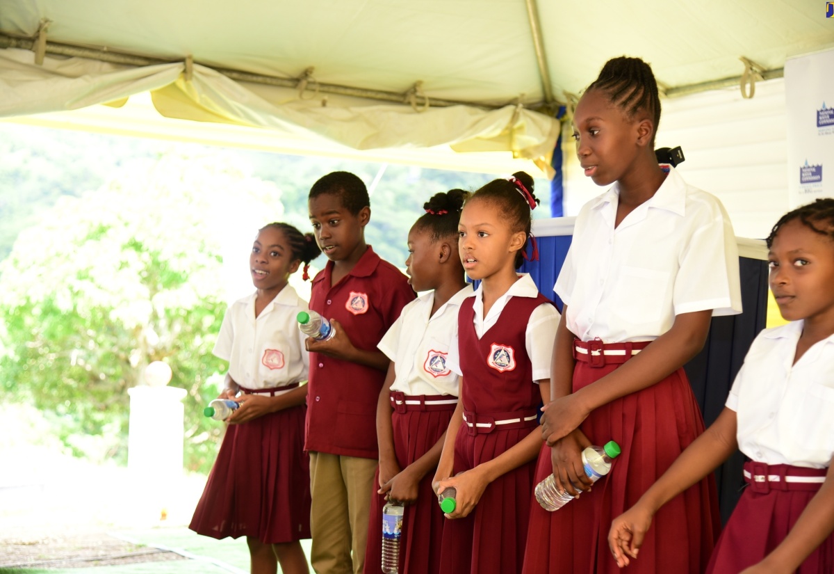 Students of the Ginger Ridge Primary and Infant School in St. Catherine perform at the recent commissioning of the multimillion-dollar Connors/Ginger Ridge Water Scheme at a ceremony held at the school.