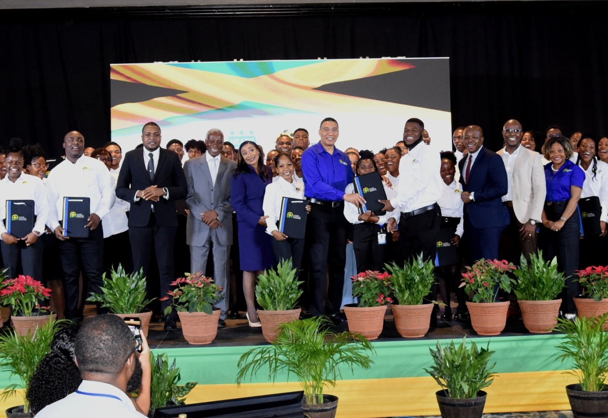 Prime Minister, the Most Hon. Andrew Holness (centre), is surrounded by the Clarendon participants in the Government’s Learning and Investment for Transformation (LIFT) Programme as well as Members of Parliament for the parish and HEART NSTA/Trust executives. Occasion was the Social Advancement ceremony for the first cohort of participants in the programme, held at The Jamaica Pegasus hotel in New Kingston on December 15. The officials are (from left) Minister without Portfolio in the Office of the Prime Minister with Responsibility for Information and Member of Parliament (MP) for Clarendon North Central, Hon. Robert Morgan; Chairman of the Board of Directors, HEART NSTA/Trust, Professor Alvin Wint; Managing Director of the HEART NSTA/Trust, Dr. Taneisha Ingleton; Minister of Labour and Social Security and MP for Clarendon South Eastern, Hon. Pearnel Charles Jr.; Clarendon Northern MP, Dwight Sibbles; and Minister without Portfolio in the Office of the Prime Minister with responsibility for Skills and Digital Transformation, Senator Dr. the Hon. Dana Morris Dixon.