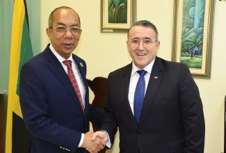 Deputy Prime Minister and Minister of National Security, Hon. Dr. Horace Chang (left), shakes hands with Chilean Ambassador, His Excellency José Antonio Cabedo Espinosa, during a courtesy call at the Ministry’s offices in Kingston on December 7.

