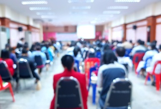 Blurred picture of conference of parents and teachers. 