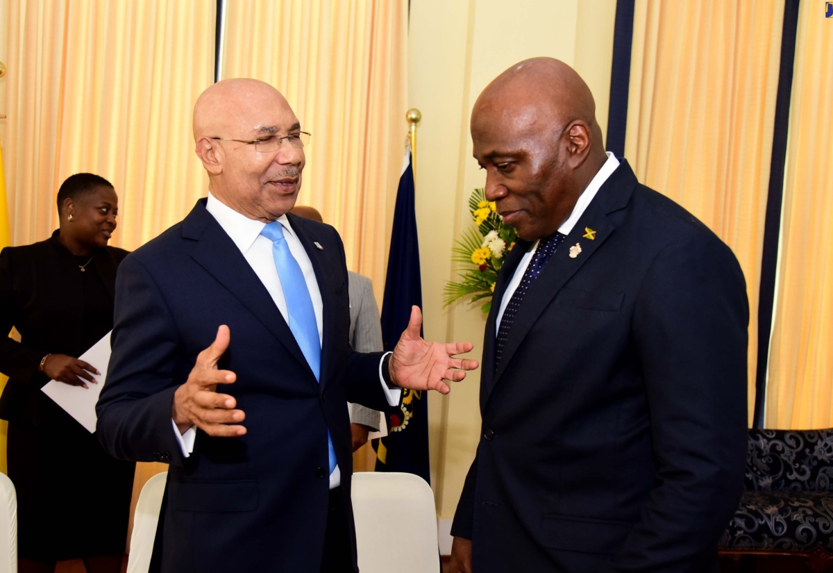 Governor-General, His Excellency the Most Hon. Sir Patrick Allen (left), converses with Chief Justice, Hon. Bryan Sykes, during a recent swearing-in ceremony at King’s House for nine members of the judiciary who have been appointed to higher office.

