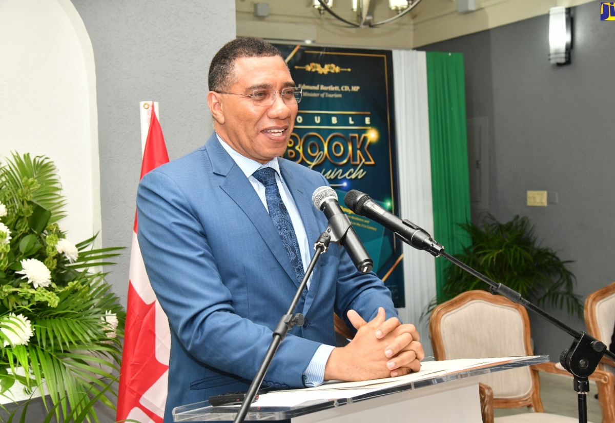 Prime Minister, the Most Hon. Andrew Holness, addresses Tourism Minister, Hon. Edmund Bartlett’s double book launch, on January 10, at Devon House in Kingston. The books are titled ‘The Journey, the Service, the Man Edmund Bartlett’s Time Capsule – 1980 -2022’, and ‘Thought Leadership on Tourism Resilience and Sustainability in the 21st Century’.

