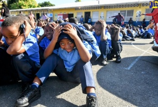 Students at the Allman Town Primary School in Kingston participate in an earthquake drill at the institution last year. The drill was conducted by a team from the Office of Disaster Preparedness and Emergency Management (ODPEM).