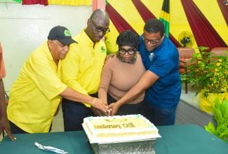 President, College of Agriculture, Science and Education (CASE), Dr. Derrick Deslandes (right), and President, Ole Farmers Association, North America (OFANA), Norma Jarrett (second right), participate in cutting the 114th anniversary cake at the Portland-based school. Also participating are (from left) Immediate Past President, CASE Alumni Association (CASE AA) Immediate Past President, Pius Lacan, and current President, Everett Hyatt.


