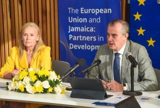 Director with the European Union (EU), Felix Fernandez Shaw, addresses a media breakfast at the EU Ambassador’s residence in Kingston today (January 25). At left is Head of the European Union (EU) Delegation to Jamaica, Ambassador Marianne Van Steen.


