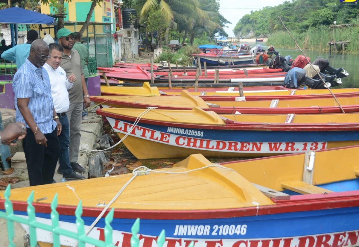 Minister of Local Government and Community Development, Hon. Desmond McKenzie (left), is joined by Minister without Portfolio in the Ministry of Economic Growth & Job Creation, Senator the Hon. Matthew Samuda (second from left), and Ocho Rios Councillor, Michael Belnavis, in touring the White River Fisherman’s Village in St. Ann, on Friday, January 26.

