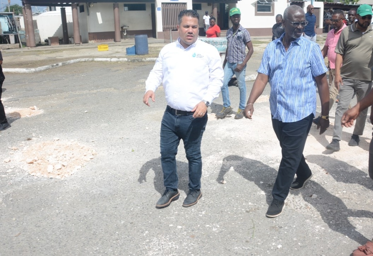 Minister of Local Government and Community Development, Hon. Desmond McKenzie, (right), and Minister without Portfolio in the Ministry of Economic Growth and Job Creation, Senator the Hon. Matthew Samuda, tour the Ocho Rios Transportation Centre in St. Ann on Friday (January 26), to assess the condition of the facility.