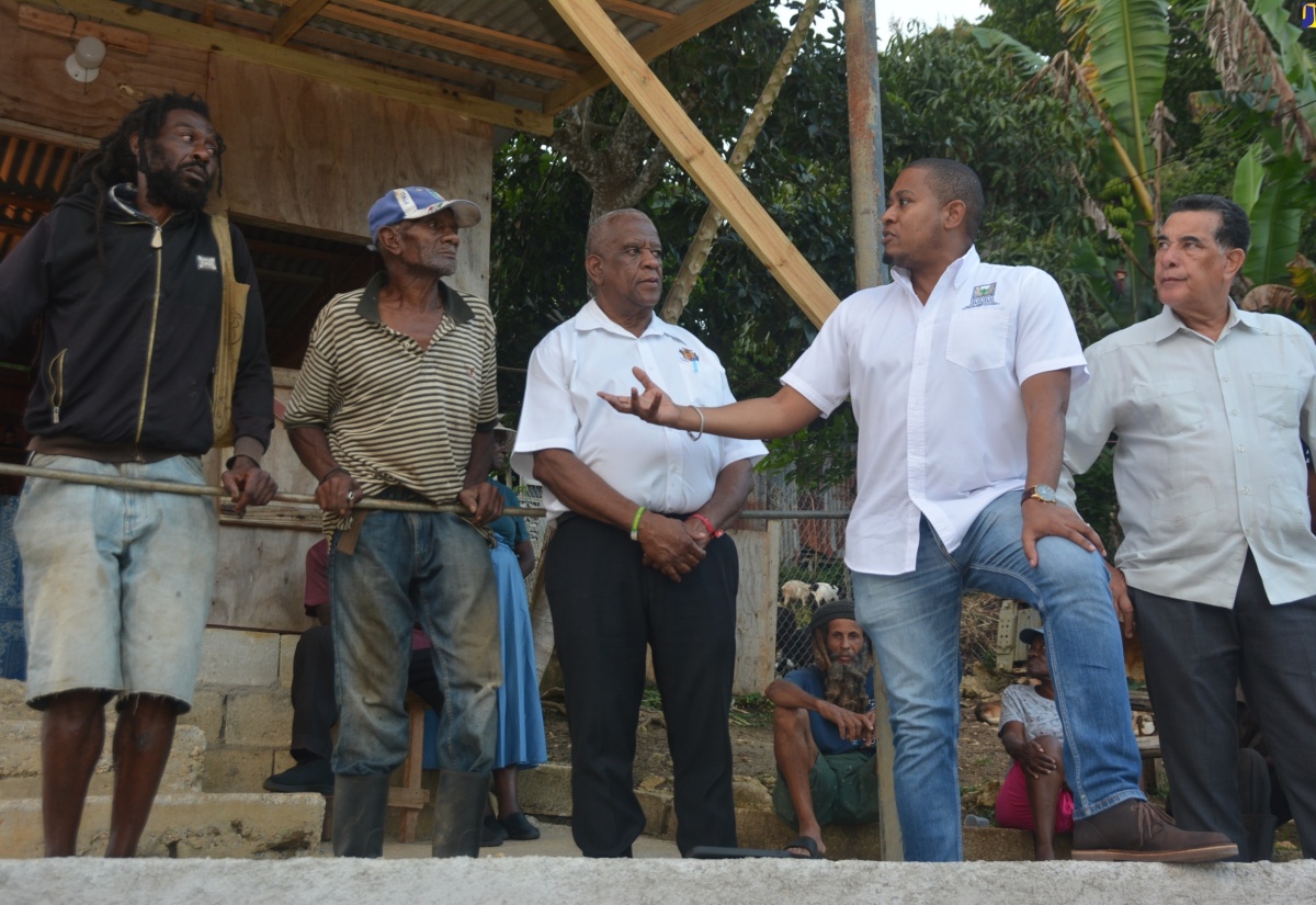 Minister of Agriculture, Fisheries and Mining, Hon. Floyd Green (second from right), converses with farmers Fabian Stennett (left) and Errol Reid (second from left), during a visit to Welcome Hall, St. James, on Thursday, January 17. Looking on are Minister of State in the Ministry of Agriculture, Fisheries and Mining, Hon. Franklin Witter (centre), and Minister of State in the Office of the Prime Minister (West), Hon. Homer Davis.

 