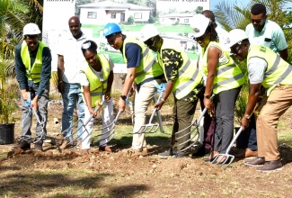 Prime Minister, the Most Hon.  Andrew Holness (third left, front row) and Local Government and Community Development Minister, Hon. Desmond McKenzie (fourth left, front row), break ground for the construction of a Matron’s quarters at the Hanover Infirmary, on Friday ( January 19). Also participating are (from left) Member of Parliament for Hanover Eastern, Dave Brown; Matron of the Infirmary, Kayon Dyer; Member of Parliament for Hanover Western, Tamika Davis and Councillor for the Lucea Division, Easton Edwards. Observing in the background (from left) are Councillor for the Hopewell Division, Devon Brown; Councillor for the Riverside Division, Daren Barnes (partially hidden) and Councillor Caretaker for the Green Island Division, Demar McKenzie.  

