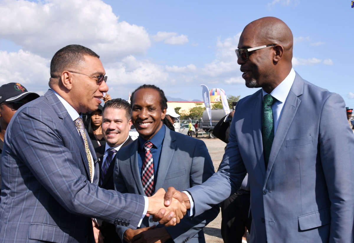 Prime Minister, the Most Hon. Andrew Holness (left), is greeted by Member of Parliament for St. Catherine South Eastern, Robert Miller (right), at the official launch of the Portmore Resilience Park, located at Lot 26 Portmore Town Centre in St. Catherine, on January 17. Sharing the moment are Minister of State in the Ministry of Foreign Affairs and Foreign Trade and Member of Parliament,  St. Catherine East Central, Hon. Alando Terrelonge (second right), and Minister without Portfolio in the Ministry of Economic Growth and Job Creation, Senator the Hon. Matthew Samuda. Construction for the park is expected to begin in February and is slated for completion in September 2025.
 
