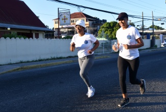 Minister of Education and Youth, Hon. Fayval Williams (right) and President, Jamaica Association of Education Officers, Fiona Morris Webb, participate in the 3K Walk/Run in aid of the Braeton Primary and Junior High School in Portmore, St. Catherine today (January 28).